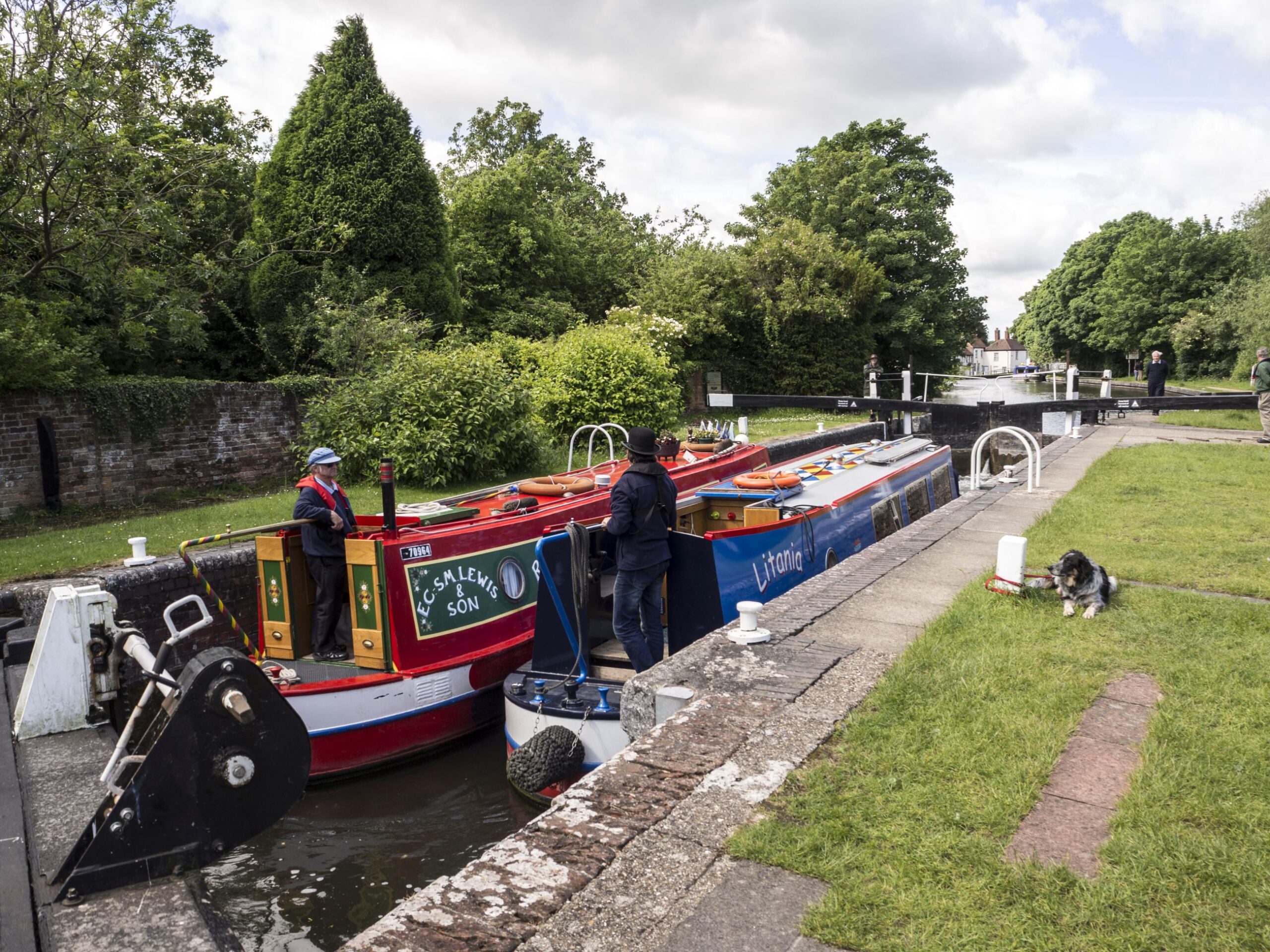 Two boats in a lock - the steerers are enjoying fellowship.